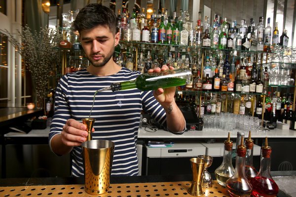 Mequignon mxing up a flavorful cocktail at Danico