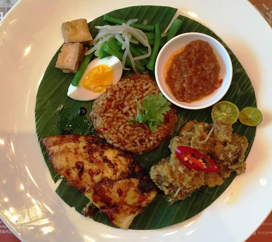 Sample portions of gado gado, beef rendang, and grilled red snapper