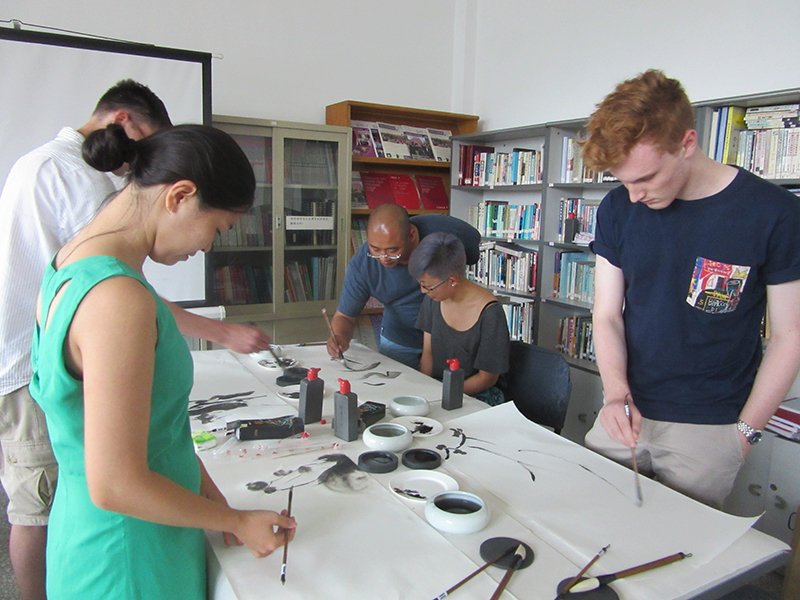 Hua laoshi and a group of students tackle Chinese painting