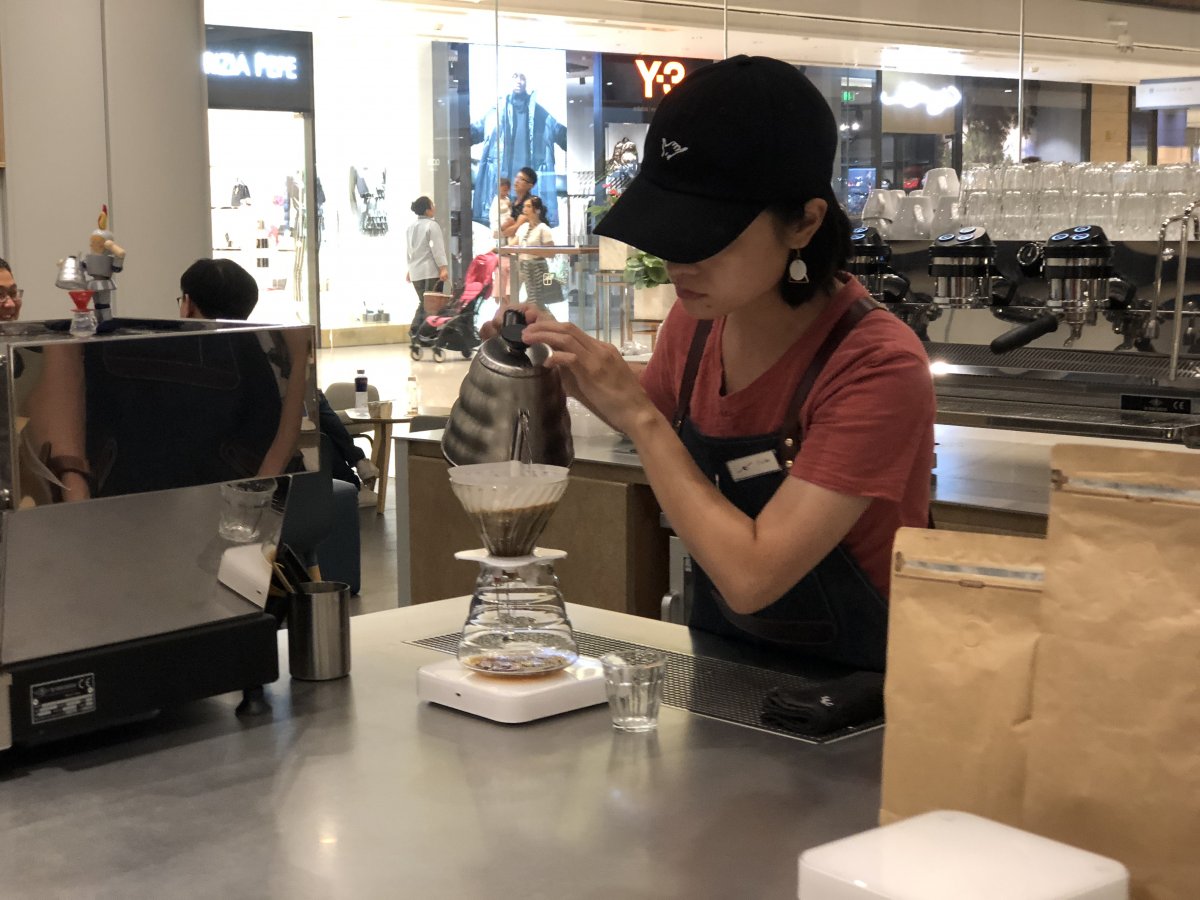 Our barista readies a cupful of blissfully satisfying Blue Mountain coffee