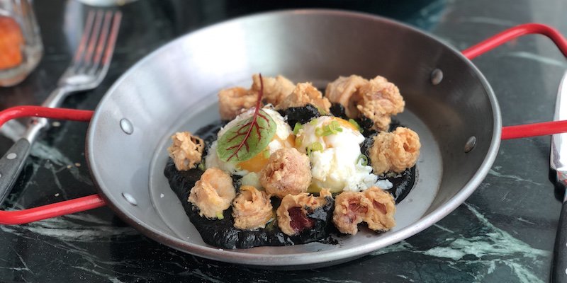 Fried squid with slow-cooked egg and ink sauce