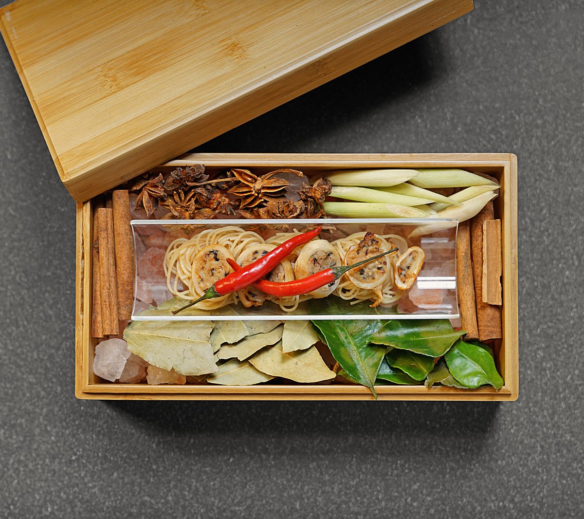 The stuffed squid catches the senses with its accompanying box adorned with various spices