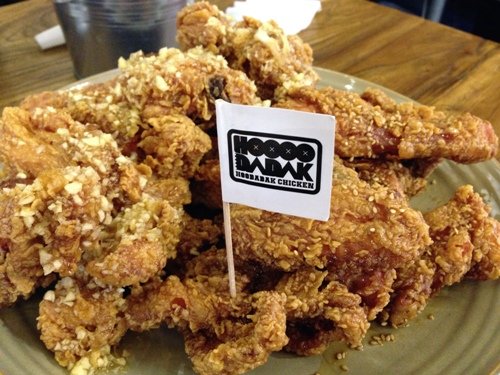 A half and half serving of garlic chicken and sweet soy chicken