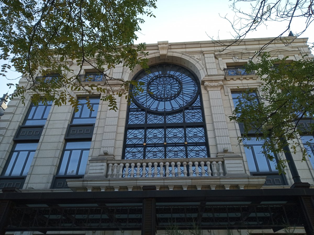 A stately looking window alludes to the French Gothic architecture of the Notre-Dame