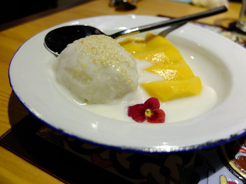 Sticky rice pudding with condensed milk and fresh mango