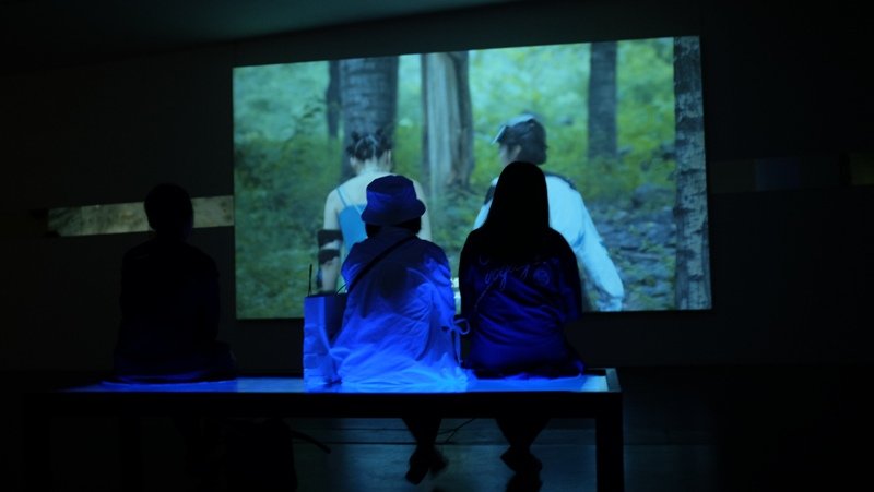 Visitors watch Chen Zhou's "Blue Hole"