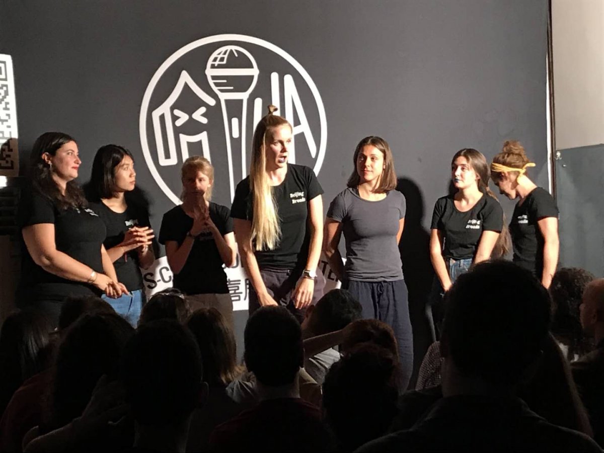 Anete Elken (center) performs as part of the Beijing Broads all-female comedy troupe
