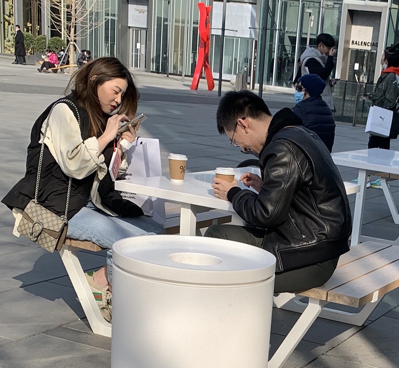 Patrons at %Arabica outside the Opposite House catch up on the latest Covid-19 gossip over a coffee in the sunshine