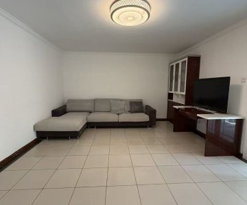 Huge square living room with L-shaped sofa, TV cabinet, bright and clutter-free