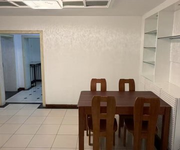Separate dining room with solid wood dining table and four chairs, wide space for family meals
