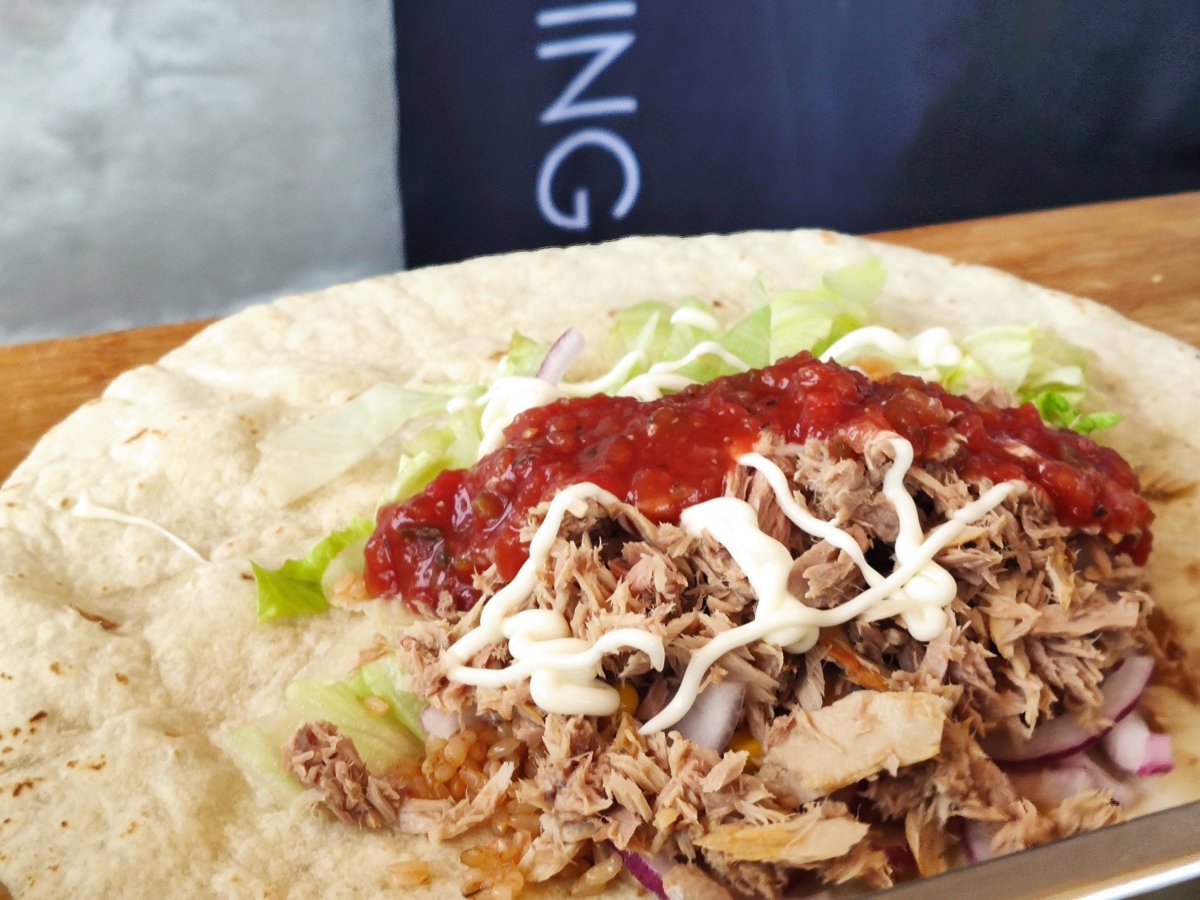 A tuna burrito ready to be wrapped