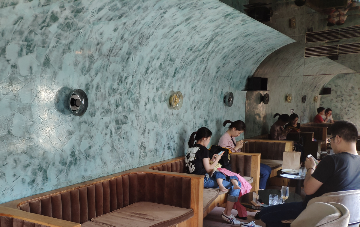 The large mirror at the end of this train car-shaped room makes it seem even longer than it is