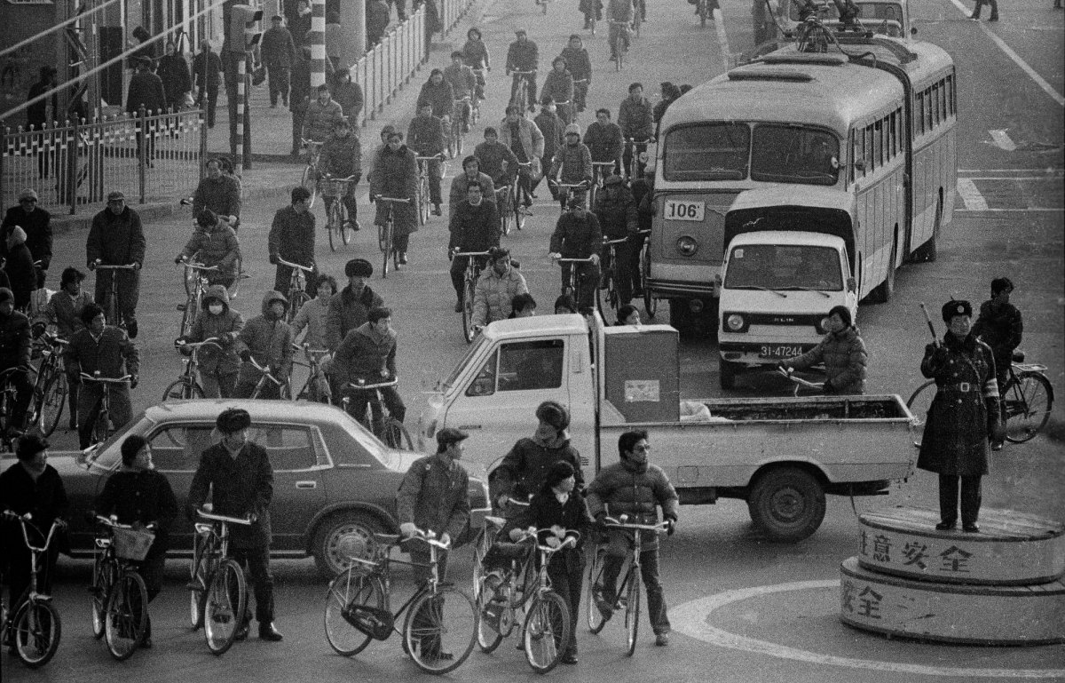 A private car was a rare sight in the downtown traffic - Beijing, 1985