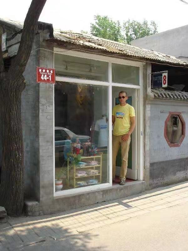 Dominic in the entrance of Plastered 8's Nanluoguxiang branch, back in the day
