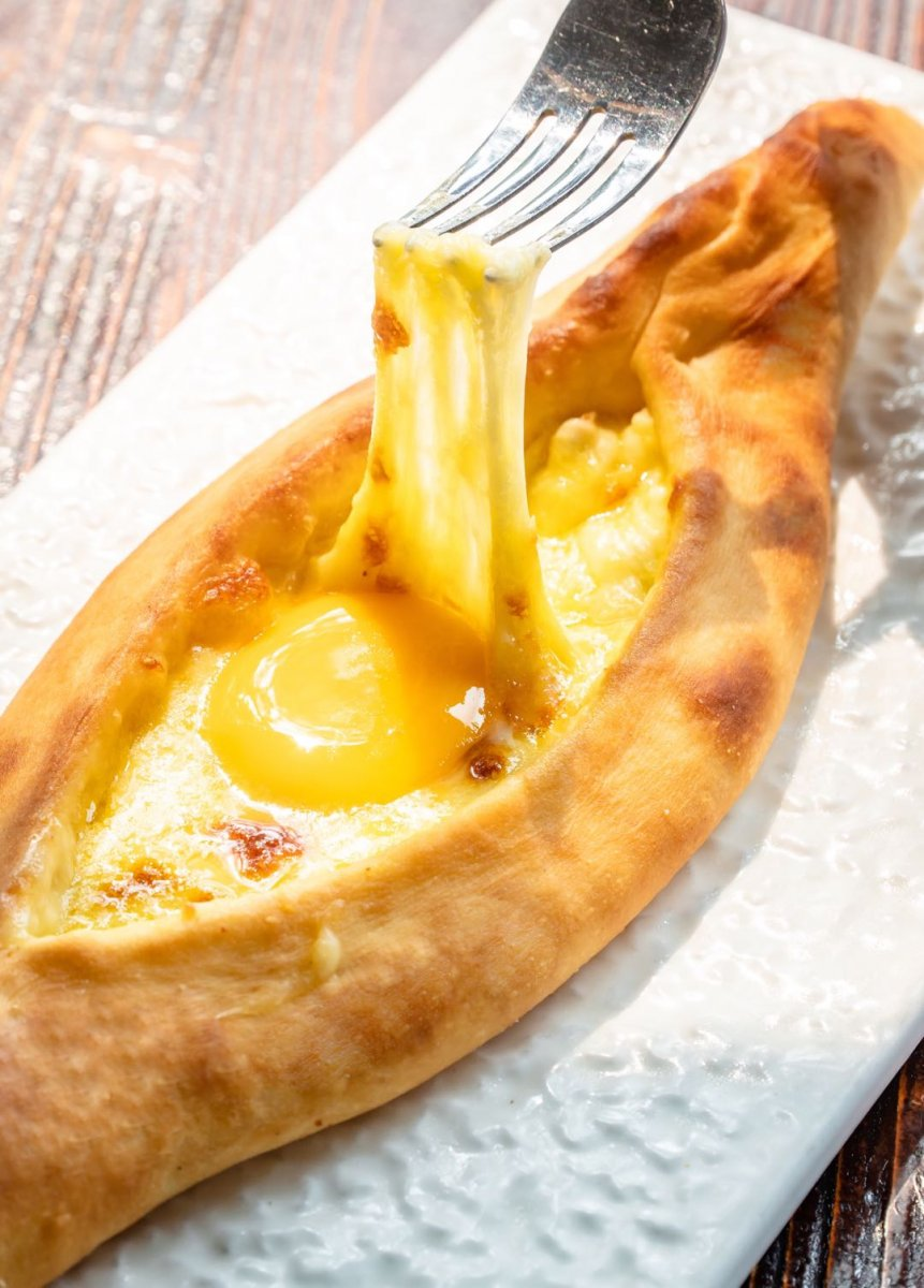 Delicious, melty cheese atop the Adjarian khachapuri