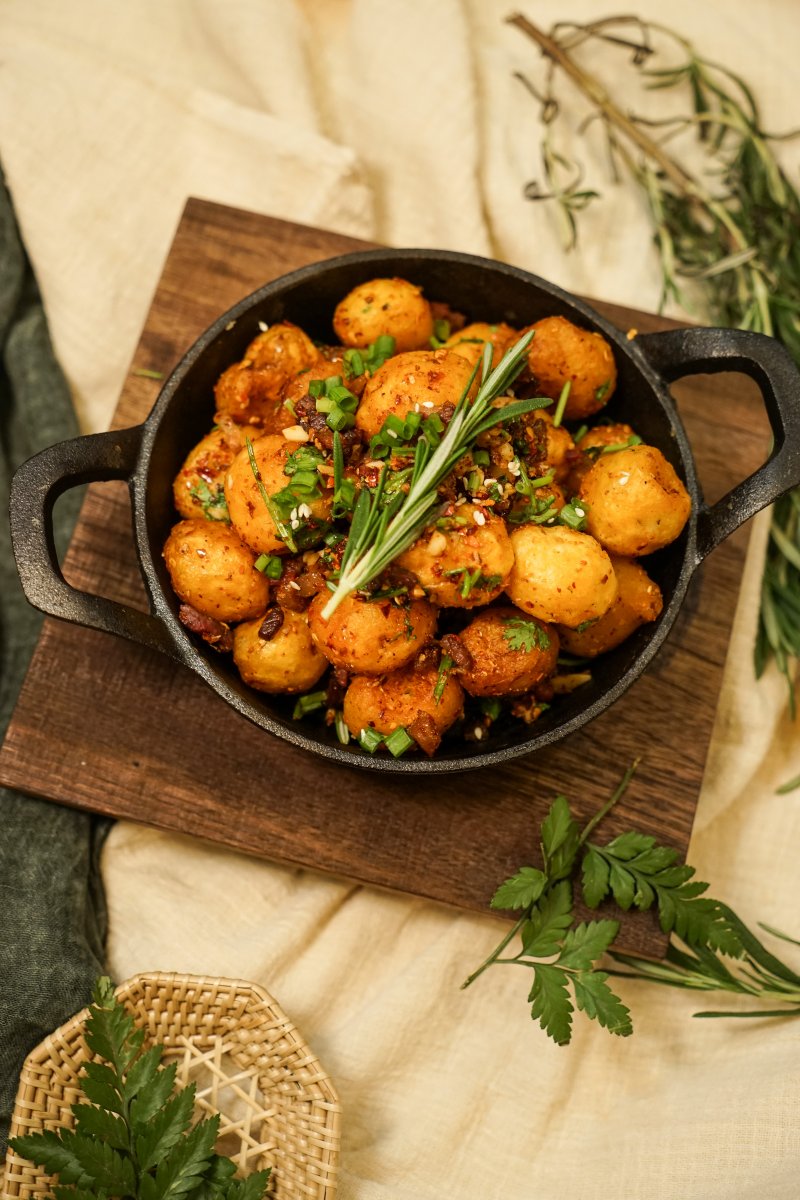 The mini potatoes are tossed with Sue's grandma's homemade peppers