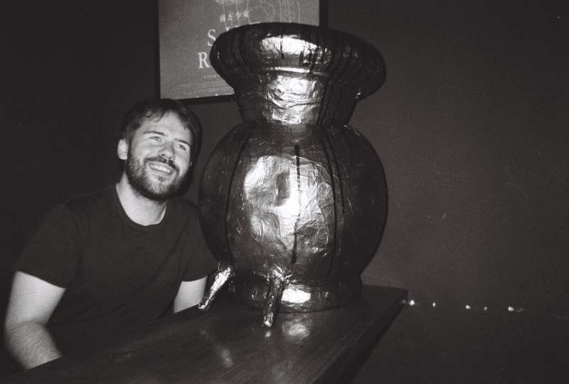 Byrne with what appears to be a space helmet made for giant slugs
