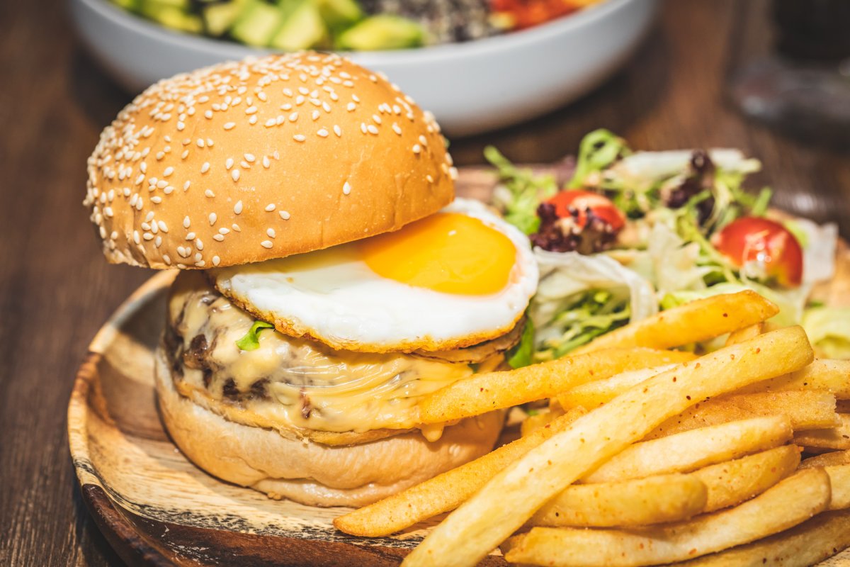 The signature beef burger, complete with melty cheese and fried egg