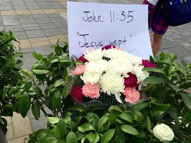 Flower Memorials at Site of Sanlitun Stabbings Regularly Cleared Away by Security