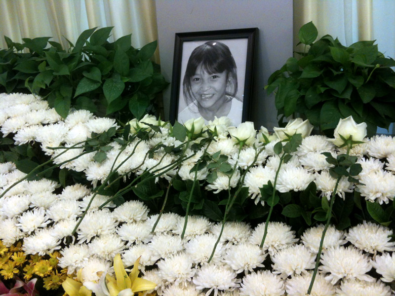 Memorial Service Recalls the Brief Life of 8-Year-Old Orphan as Her Body Remains in Morgue