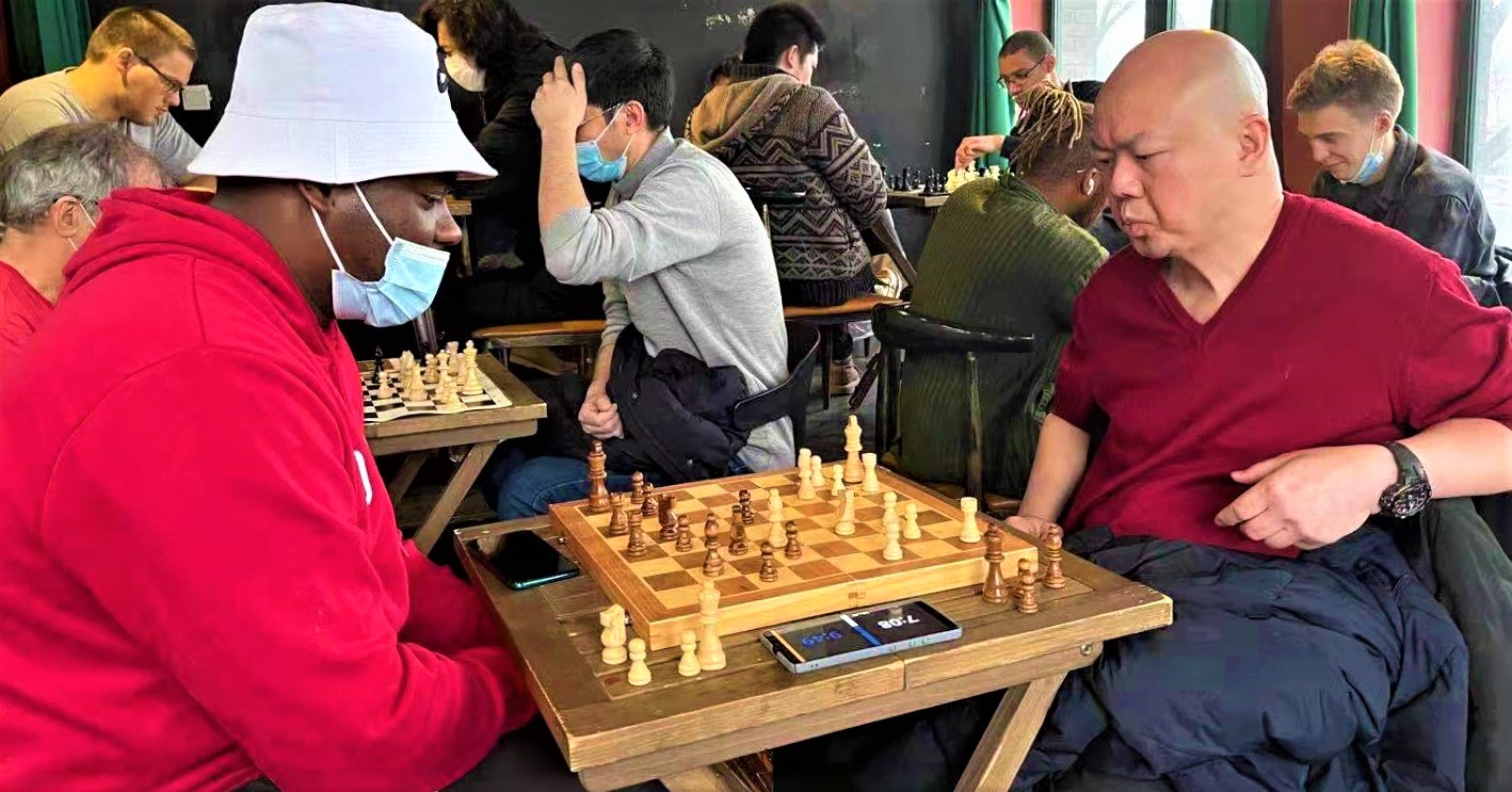 Jing's Gambit: Chess Players Trade Pieces at the Camera Stylo Club
